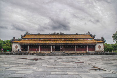 View of temple building against cloudy sky