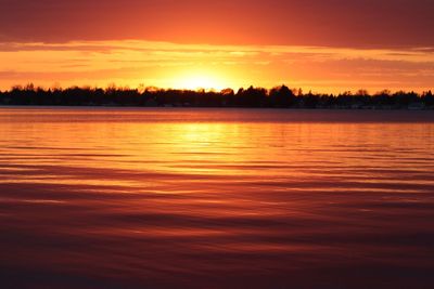 Scenic view of sunset over lake