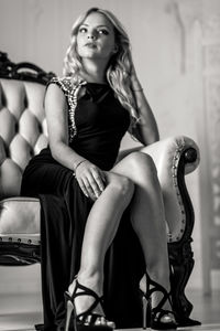 Portrait of young woman sitting outdoors