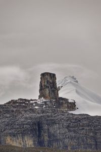 Low angle view of rock formations against sky