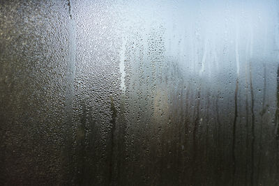 Full frame shot of wet glass window