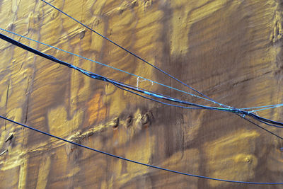 Low angle view of electricity pylon against sky
