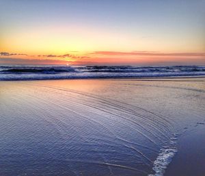 Scenic view of sea at sunset