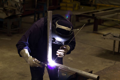 Man working on metal structure