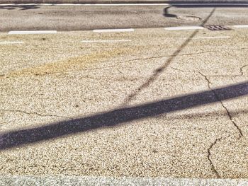 Shadow of people on road