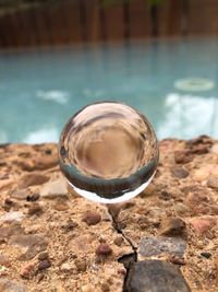 Close-up of crystal ball on water