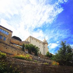 Low angle view of building against blue sky