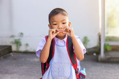 Portrait of cute girl standing outdoors