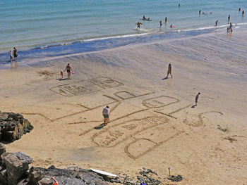 People playing on beach