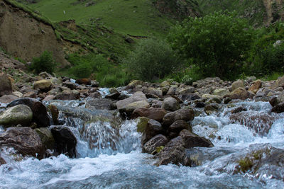 River flowing through rocks in forest