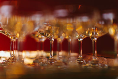 A close of focus view of a champagne glass arrangement in a wedding ceremony