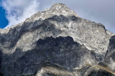 Low angle view of rock formation against sky