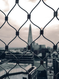 Full frame shot of chainlink fence against sky