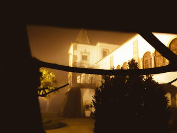 Close-up of illuminated temple against sky at night