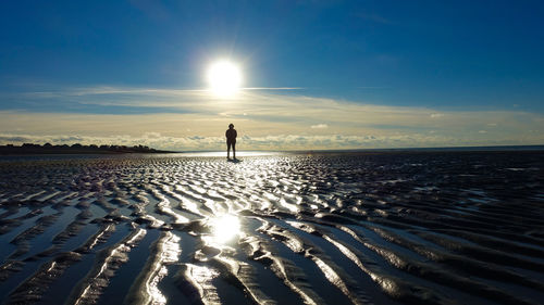 Scenic view of beach against sky during sunset