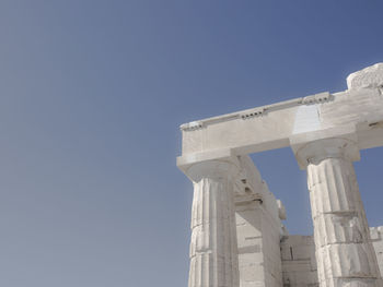 Low angle view of historical building against blue sky