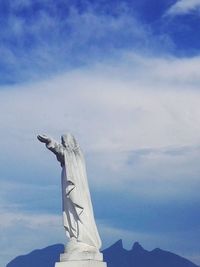 Low angle view of statue against sky