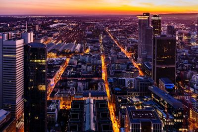 High angle view of frankfurt city lit up at sunset