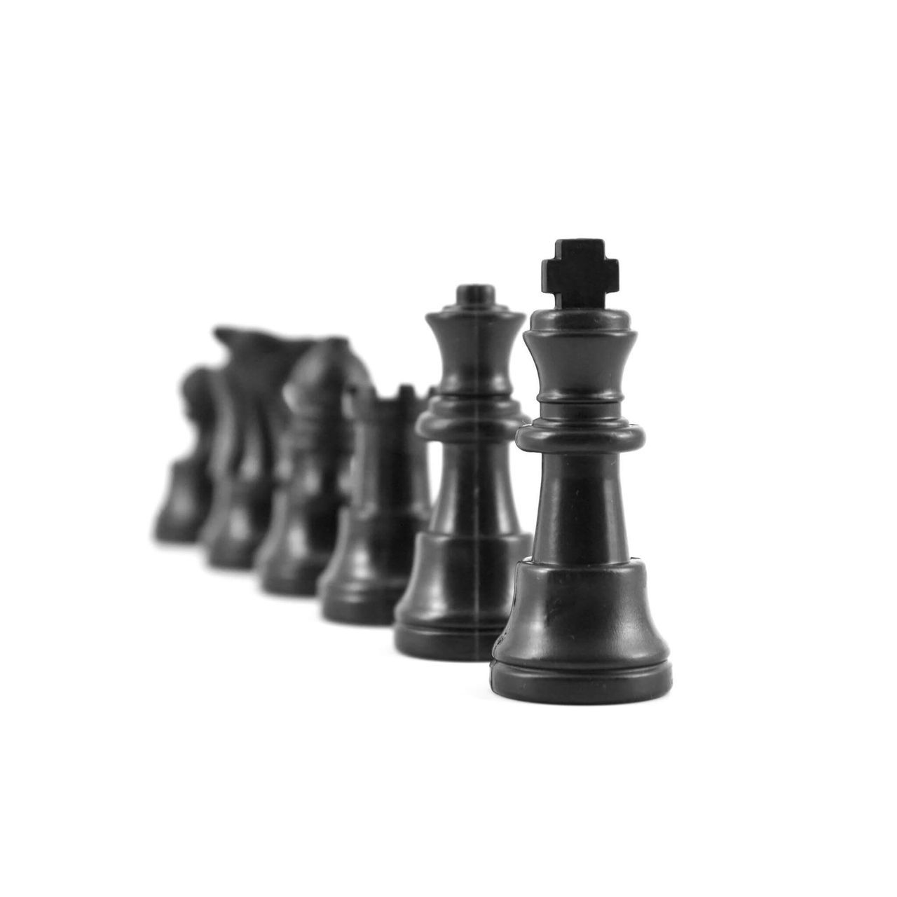 CLOSE-UP OF CHESS PIECES AGAINST THE BACKGROUND