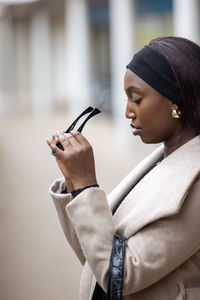 Young woman using mobile phone