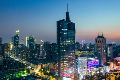 Illuminated buildings in city at night