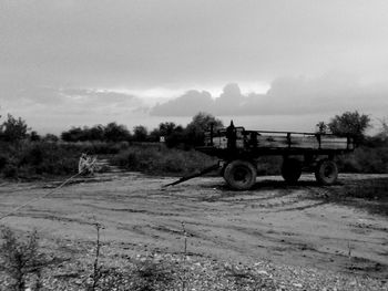 Tractor on field against sky