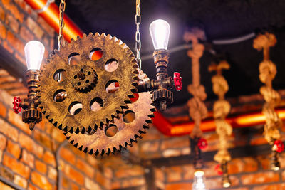 Low angle view of illuminated lanterns hanging outside building