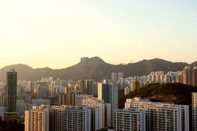 View of buildings in city against clear sky