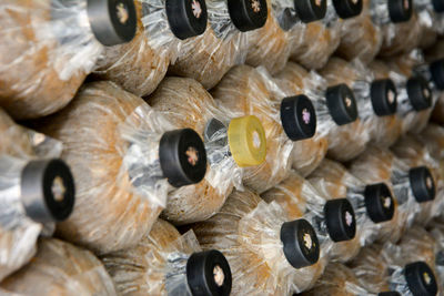 Stack of food in bottles at supermarket for sale