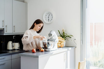 Cute girl preparing food at home