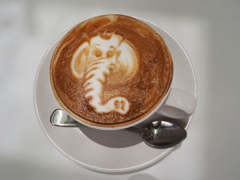 Close-up of cappuccino served on table