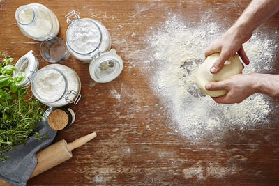 High angle view of person preparing cookies on table