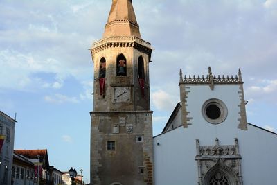 Low angle view of clock tower against sky