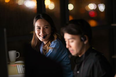 Portrait of a young woman using phone