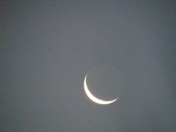 Low angle view of moon against sky at night