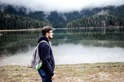 Young man looking at lake