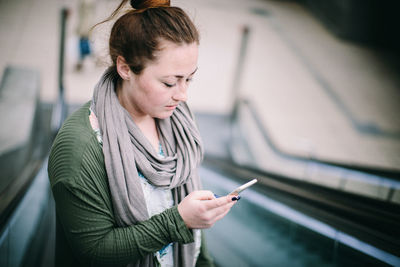 Mid adult woman using mobile phone