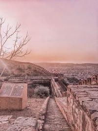 View of historic building against sky during sunset