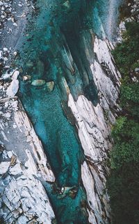 High angle view of cliff by sea