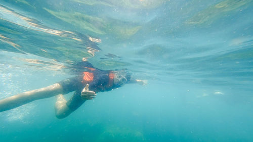 Man swimming in sea