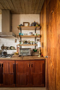 Modern kitchen japandi style, kitchen shelves in natural wood, oak