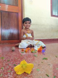 Portrait of a smiling girl sitting outdoors