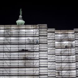 Low angle view of statue against clear sky at night