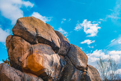 Low angle view of rock formation against sky