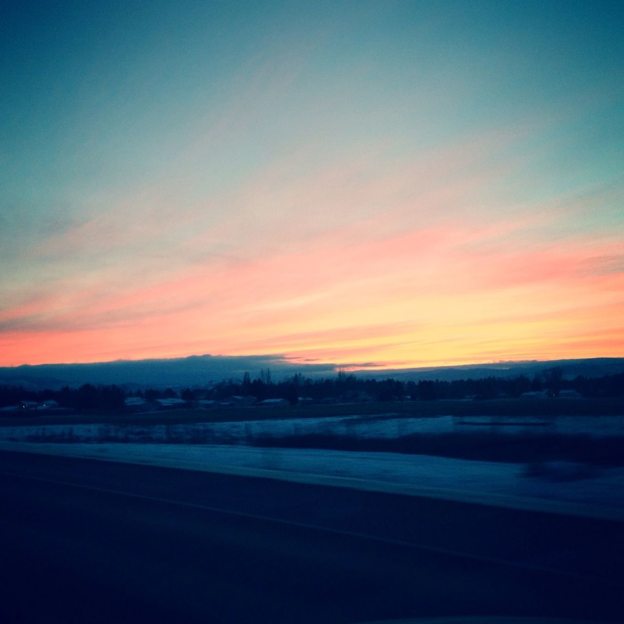 sunset, sky, scenics, tranquil scene, landscape, tranquility, beauty in nature, orange color, road, silhouette, nature, dusk, transportation, idyllic, copy space, cloud - sky, field, outdoors, no people, non-urban scene