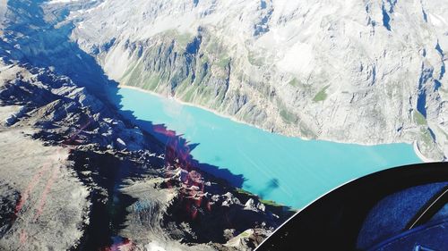 Aerial view of snowcapped mountains and lake