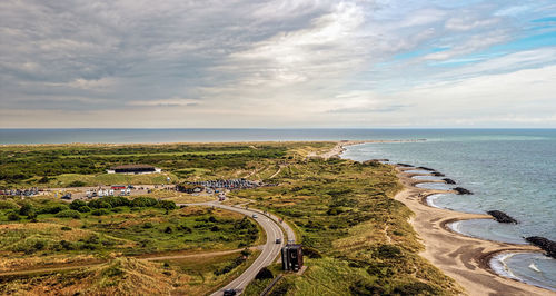 High angle view of road by sea against sky