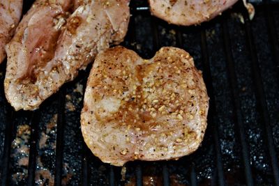 High angle view of chicken on barbecue grill