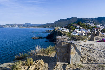 Scenic view of sea and buildings against sky