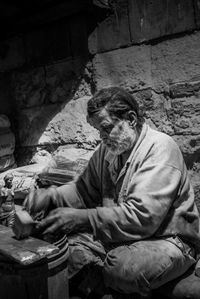 Man making statue at workshop